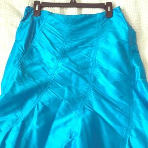 Turquoise mermaid styled skirt.